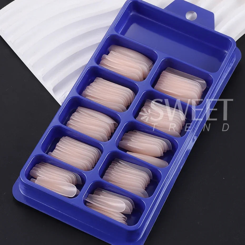 Set of 100 Nude Pink False Nails.